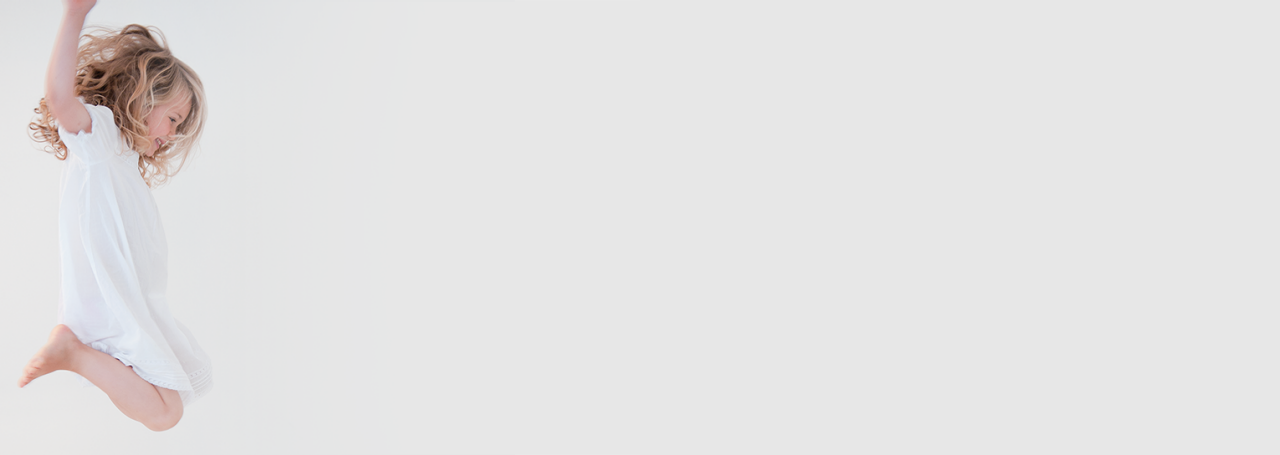 A happy child jumping in the air.